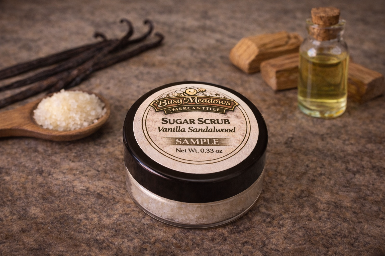 Sugar scrub sample with vanilla sandalwood scent on a rustic surface with vanilla beans and oil.